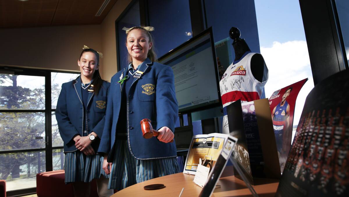 October, 2016: Emma-Kate McGrath and Jaya Keogh with items for the Loreto College gold online auction for Cambodia. 