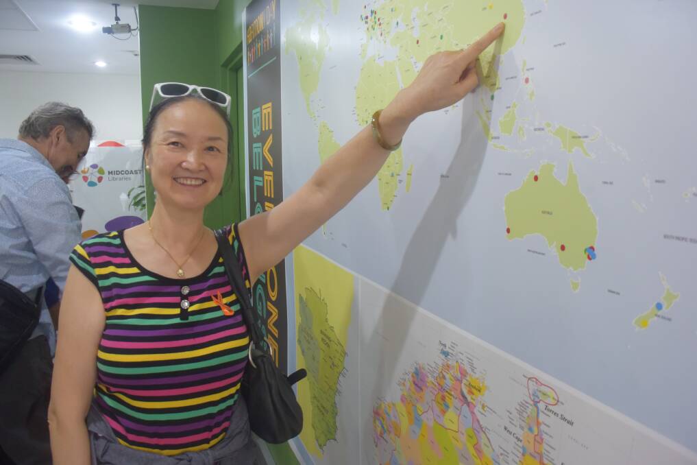 Where are you from?: Qian Zeng, priginally from China, shows the dot she placed on the world map.