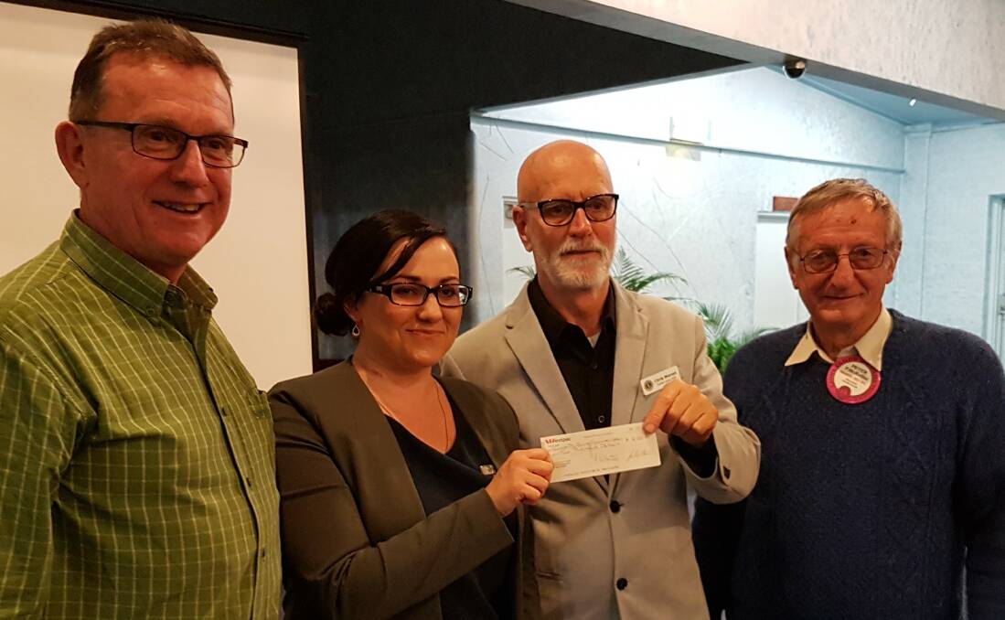 Taree Lions Club executive Phillip Grisold, Chris Warren and Peter McKellar present Danielle Atchison with a $2000 donation to Livvi's Place.