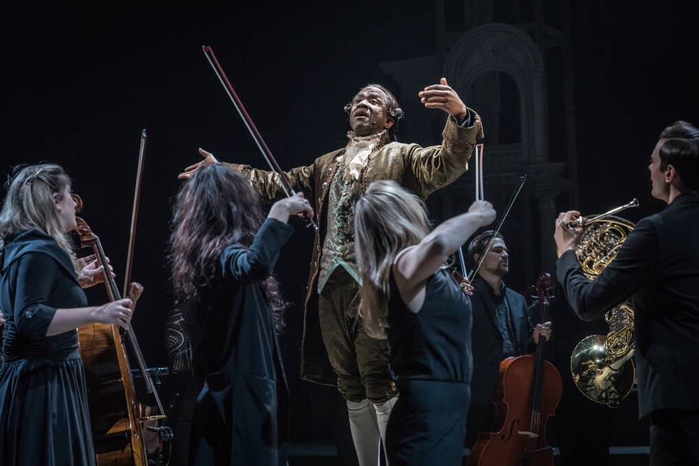 OnScreen: A scene from Amadeus, centre Lucian Msamati as Antonio Salieri with members of Southbank Sinfonia. Photo: Marc Brenner.