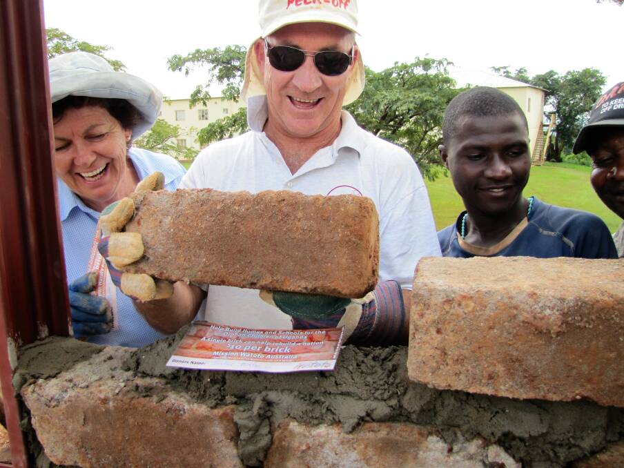 Linda and Mike Norris working on a HPI project in Uganda.