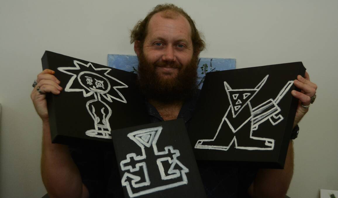 Andrew Richards with the artworks he will be showing in this year's Brushes with Life exhibition.