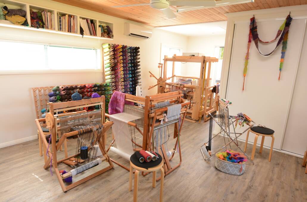 Curious Weaver: A number of looms are set up in the studio for Kaz to work on her various creations.
