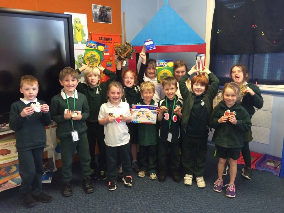Lansdowne Public: K/1/2 students showing some of the prizes they won for coming second in the Rube Golberg Challenge.