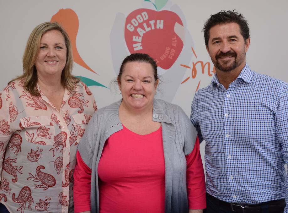 NDIS: Bridgette Gordon (centre) with one of her support workers Tracey Norris and House With No Steps Mid North Coast community engagement manager Jon Vine.