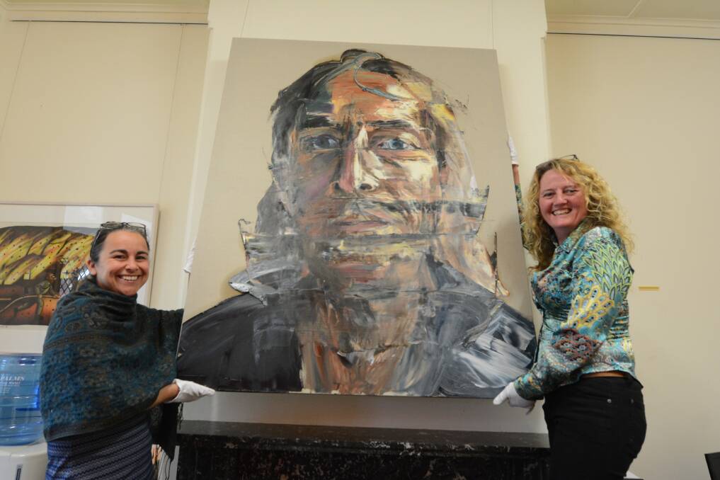 Donated: Manning Regional Art Gallery acting director Rachel Piercy and assistant director Jane Hosking with the portrait by Anh Do, which has been gifted to the Manning Regional Art Gallery city art collection.