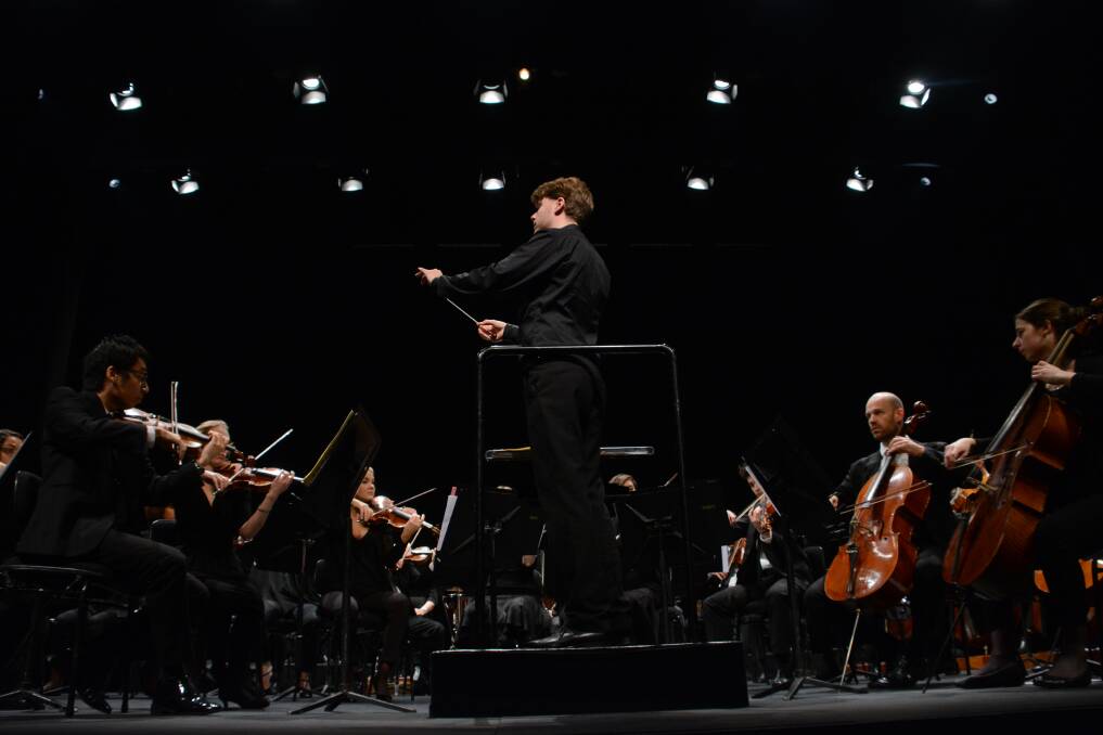 Toby Thatcher conducts the Sydney Symphony Orchestra during a school performance on Thursday May 26.