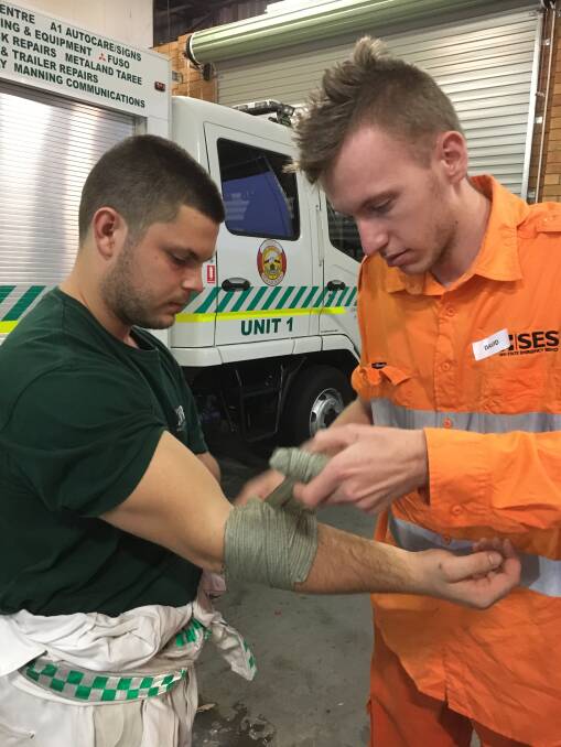 David Edmond and Josh Goulden practice putting on a multifunctional rescue bandage – a new piece of equipment for most of the first responders