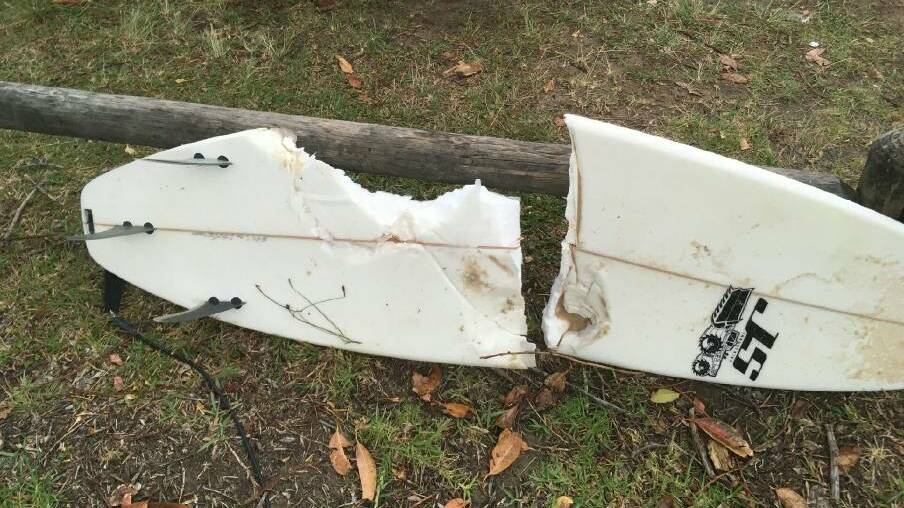 The surfboard of a surfer who was attacked by a shark this morning.