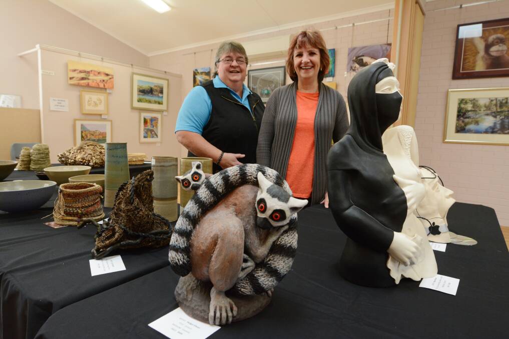 Exhibition: Taree Craft Centre's Jeanne Bradley and Sandra Wallis with just some of the sculptures, pottery and 3D work on show until July 15. Photo: Scott Calvin.