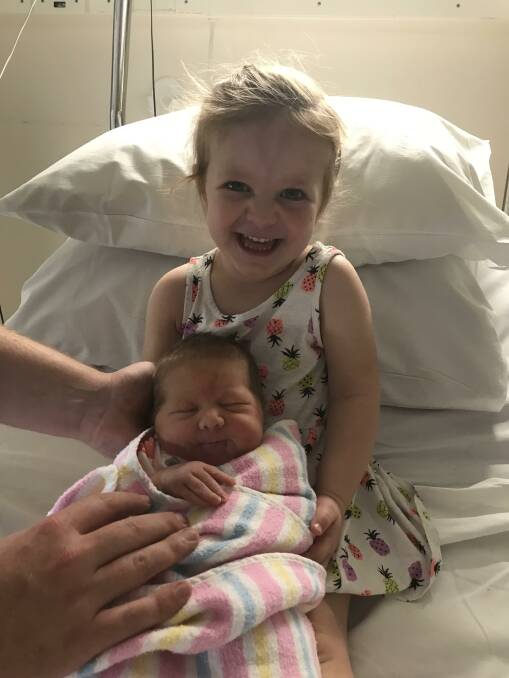 New arrival: Very proud big sister Paige Harris was excited to meet her baby sister Milla, who was born on December 18.