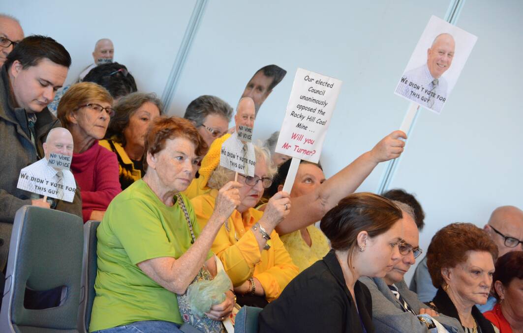 Against amalgamation: Protesters were again out in force at the MidCoast Council meeting, held in Taree on Wednesday afternoon. Carl Muxlow photo.