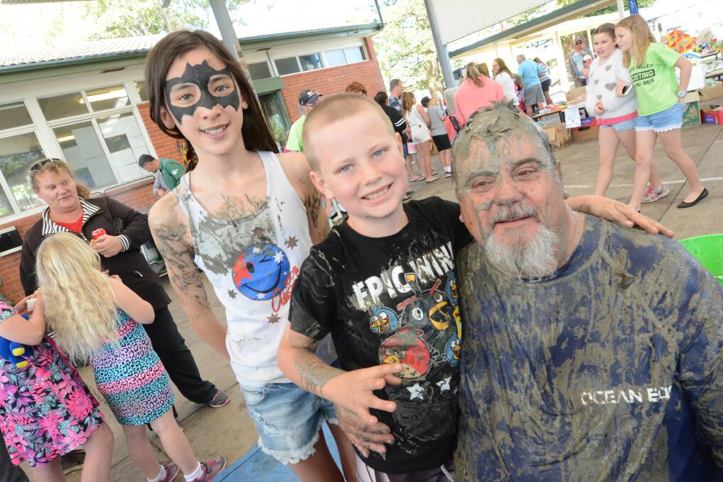 Aftermath: Kira Lowery and Lewis Wormleaton congratulate school bus driver Rodney Green, who was slimed in front of the crowd as a fundraiser for the school.