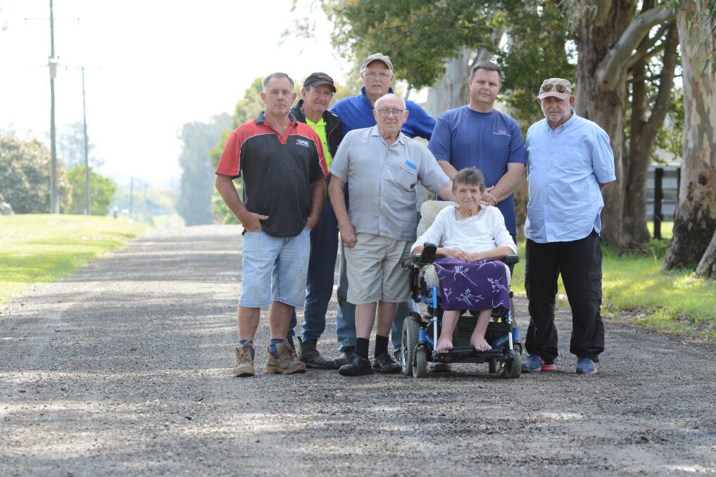 Glenthorne Road residents: Chris Tate, Noel Tynan, David Ruttley, Craig Ruttley, Terry Outrim, Alison Partridge and Stephan Renc are calling for the gravel road, which they live on, to be sealed.