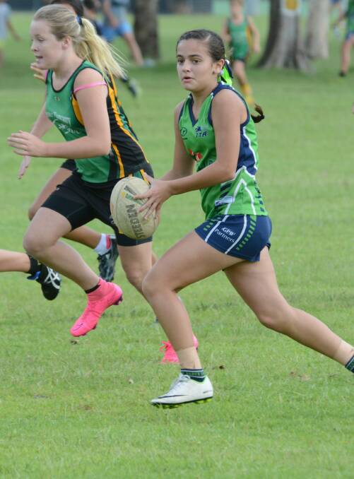 Casey Muir on the run for Taree in last year's touch gala at Taree Recreation Centre.
