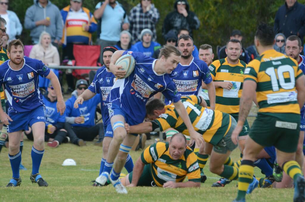 Ryhs Hessing takes the ball forward for Wallamba during the Lower North Coast Rugby Union grand final against Forster-Tuncurry at Tuncurry. Wallamba won 15-14.