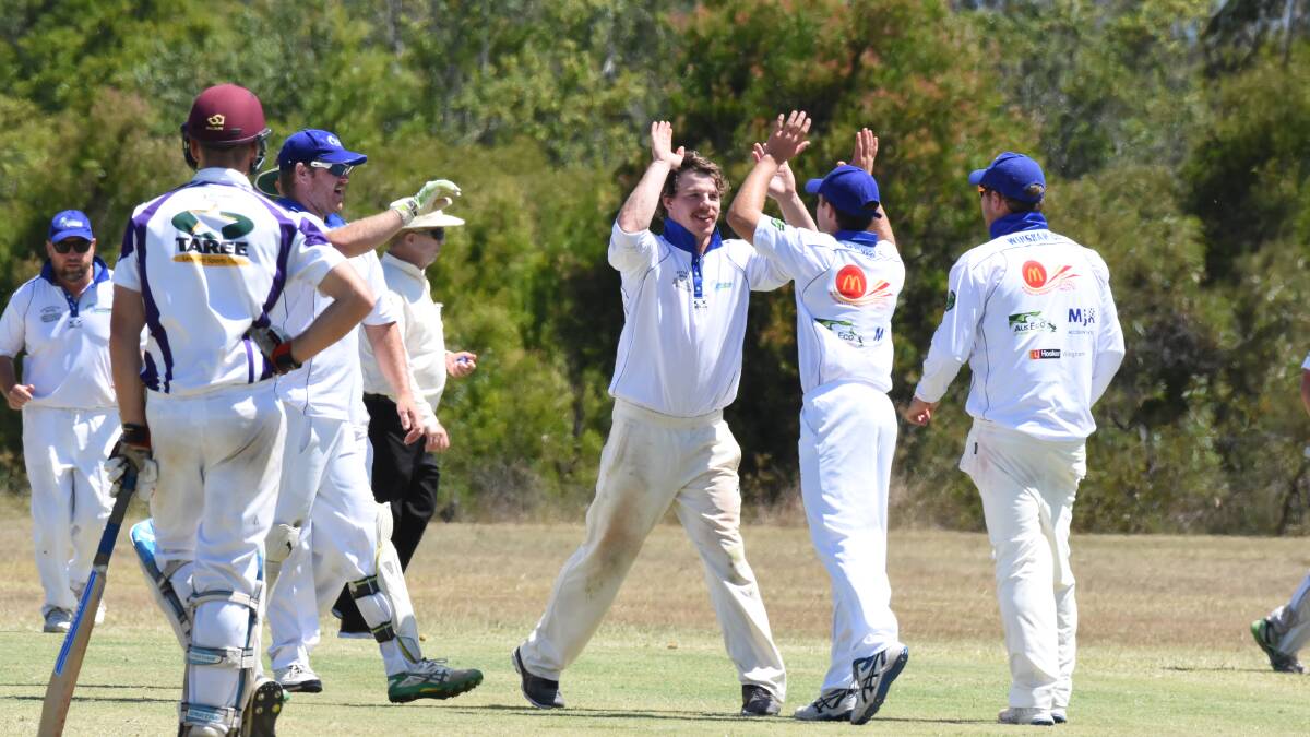 Howzat: Wingham players celebrate taking a wicket in the recent clash against United.