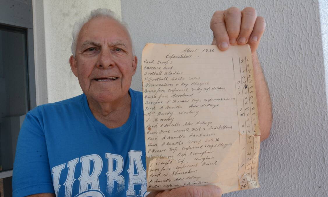 Keith Hardy with Taree Old Bar's 1936 balance sheet he unearthed. His dad, Alan, was the club's treasurer.