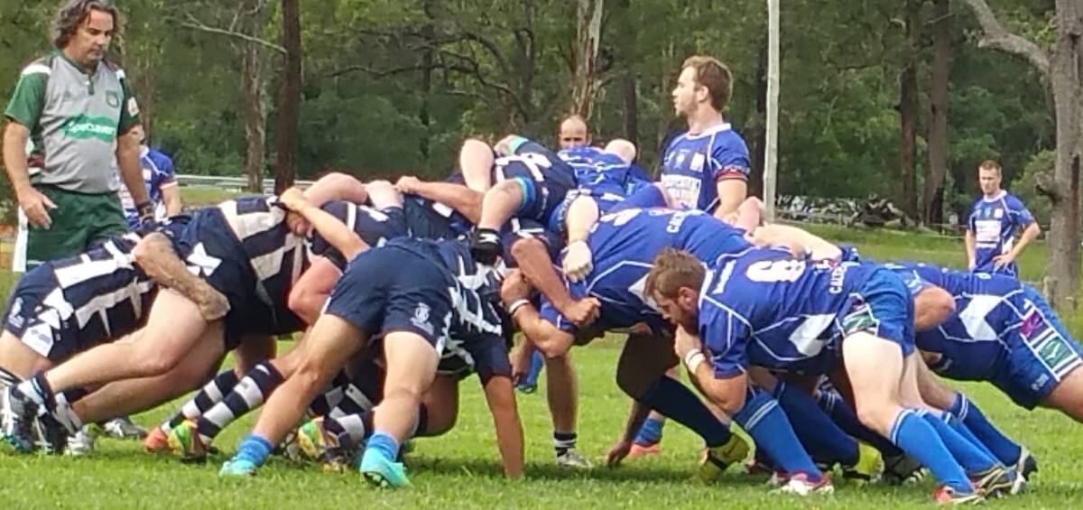 Packs down: Manning Ratz and Wallamba forwards wait for the ball to be put into the scrum during the Lower North Coast Rugby clash at Nabiac.