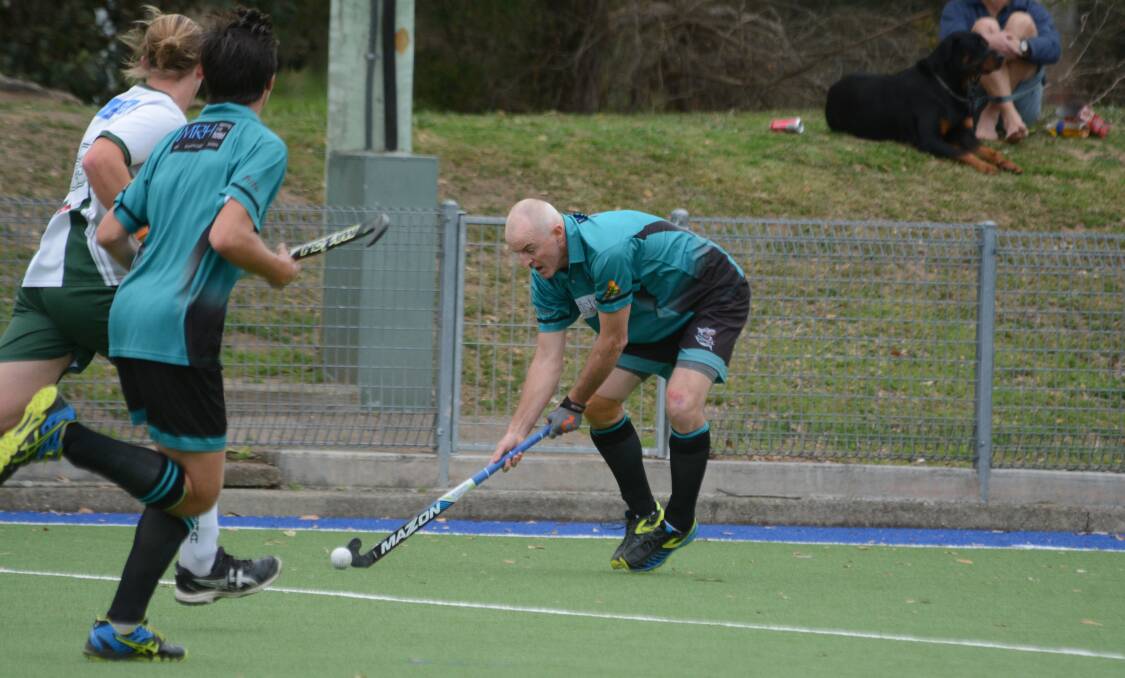 Ray Walters from Sharks controls the ball during the division two men's grand final against Wingham. Sharks won 2-0.