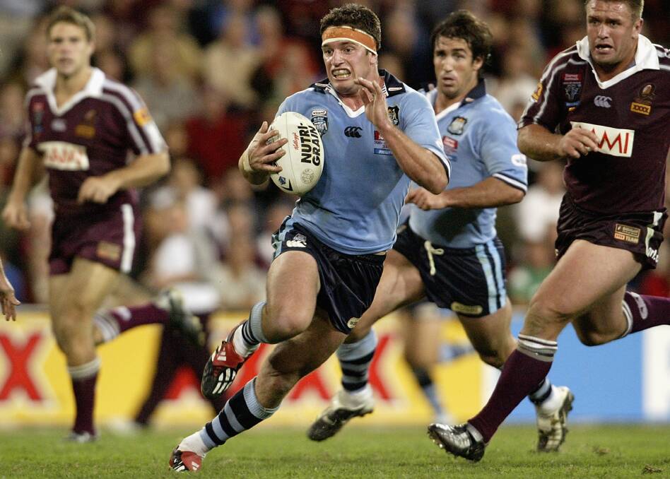 Danny Buderus charges through the Queensland defence playing for NSW in a State of Origin clash in 2005. He'll conduct a coaching clinic for juniors in Taree on July 15.