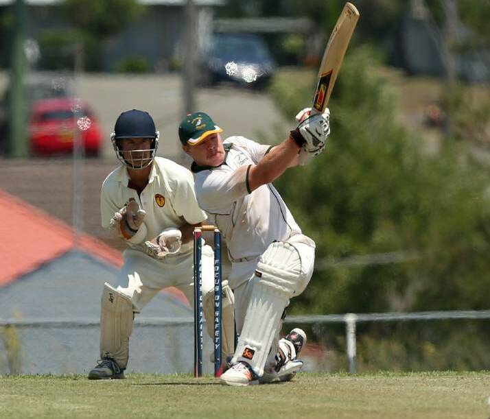 Michael Rees smashes a four batting in the Maitland competition. Photo Maitland Mercury