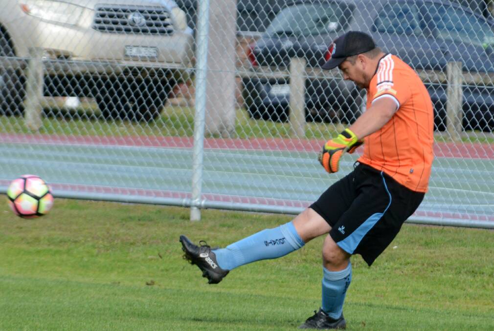 Taree goal keeper Josh Ferris clears the ball during the 2-0 loss to Wallis Lake last weekend. The Wildcats host Port Saints on Saturday at Omaru Park.