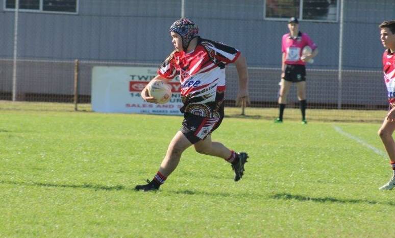 Khai Gahan makes a charge for Red Rovers.