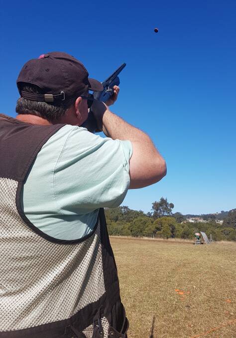 Craig Dargan takes aim during the sporting clays day at the Cedar Party Reserve range.