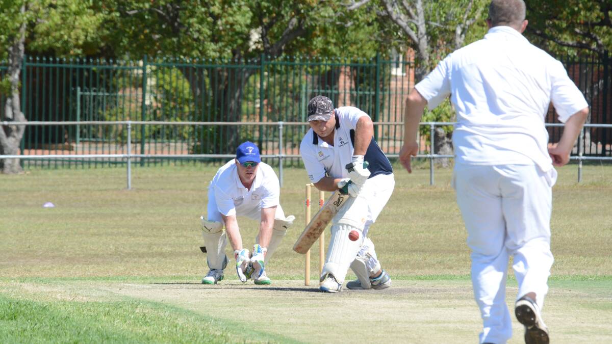 Taree West batsman JJ Burton plays defensively during his innings of 60 in the Manning first grade cricket clash against Wingham at the Johnny Martin Oval. A late batting collapse by Wingham has left Taree West on top.