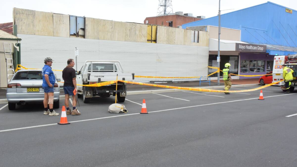 Taree Fire Brigade blocks the area in front of the Pulteney Street premises last Friday amid concerns the facade would collapse in high winds.