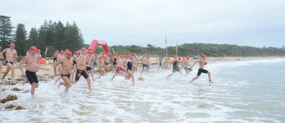 Swimmers head off at the start of the head2head ocean classic at Black Head. Brock Van Kampen won the event.
