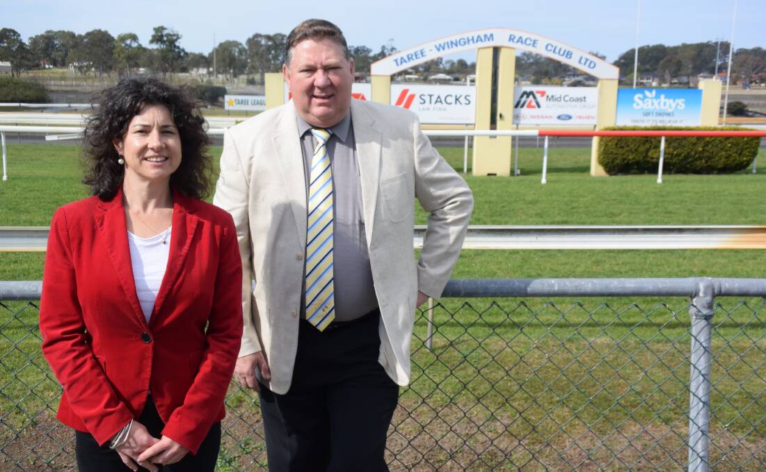 Winning team: Manning River Times advertising manager Kelly Payne and Taree-Wingham Race Club chairman Greg Coleman finalise plans for the Crazy Day and Taree Gold Cup Carnival joint promotion.