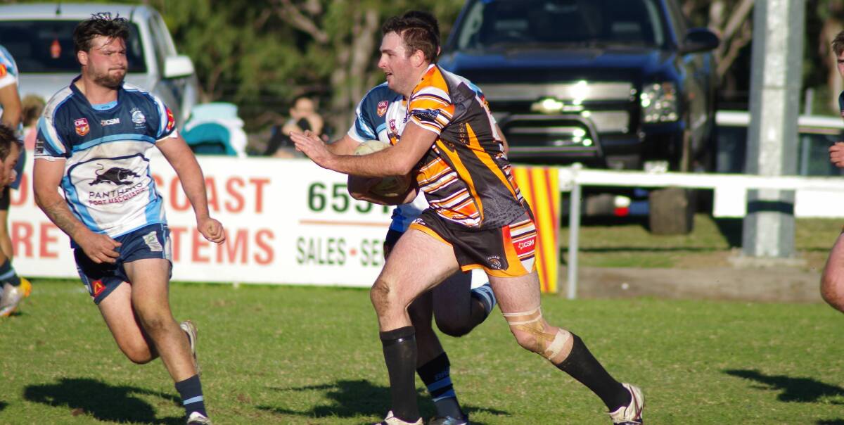 Hard working forward Michael Richards takes the ball forward in the clash against Port City at Wingham. Photo Tanya Atkins.