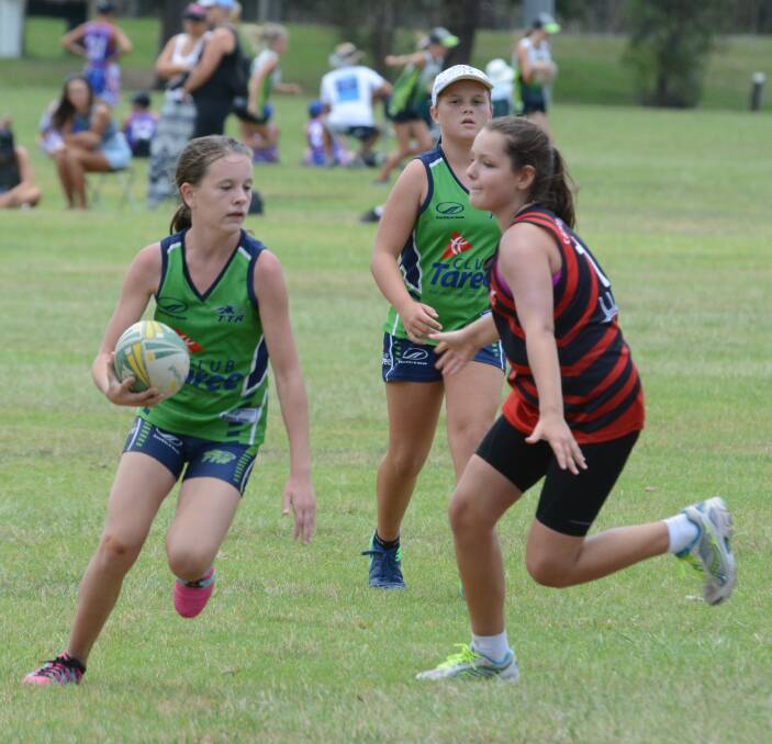 Abby Watts from Taree under 12s attempts to beat the Camden Haven defence during a clash in the Taree gala day played at Taree Recreation Centre.