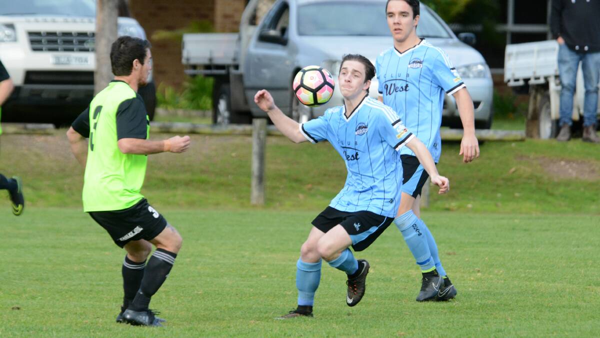 Taree's Callum Griffis looks to control the ball during the Football Mid North Coast Premier clash against Wallis Lake at Forster. Wallis Lake won 2-0.