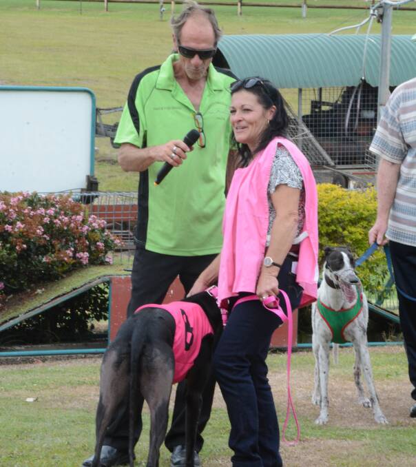 Taree Greyhound Club president Des McGeachie speaks with successful trainer Sharon Grey from Killabakh after the running of the Rocket Tools Silver Bullet Final at Taree Greyhound Club's meeting on Saturday. 