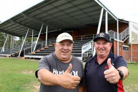 Thumbs upto the new grandstand - Wingham treasurer Craig Martin and president Scott Blanch at the Regional Australia Bank Stadium, the club's newly named home ground. Photo Scott Calvin.