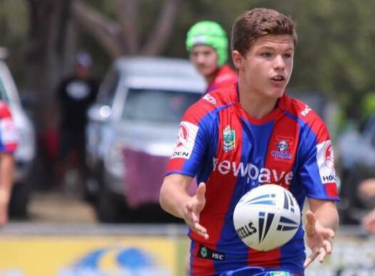 Harry Wesley from Taree fires out a pass for Newcastle Knights under 15s.