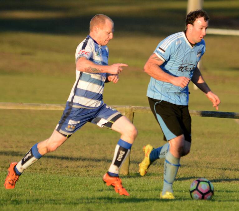Taree striker Ricky Campbell is challenged by a Macleay defender during the Football Mid North Coast Premier League clash at Taree a fortnight ago. The Wildcats won 1-0 and will now face Wallis Lake at Forster on Saturday.