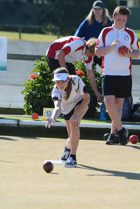 Taree High's Jade Fowles bowling in the high school day at Taree Leagues this week.