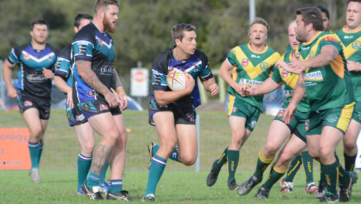 Taree City second rower Jesse Clarke takes the ball to the Forster-Tuncurry defence during the Group Three Rugby League elimination semi-final.