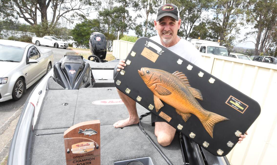 Brian Everingham with his new boat and trophies following his win in the grand final of the Australian bass tournaments held on the Richmond River.