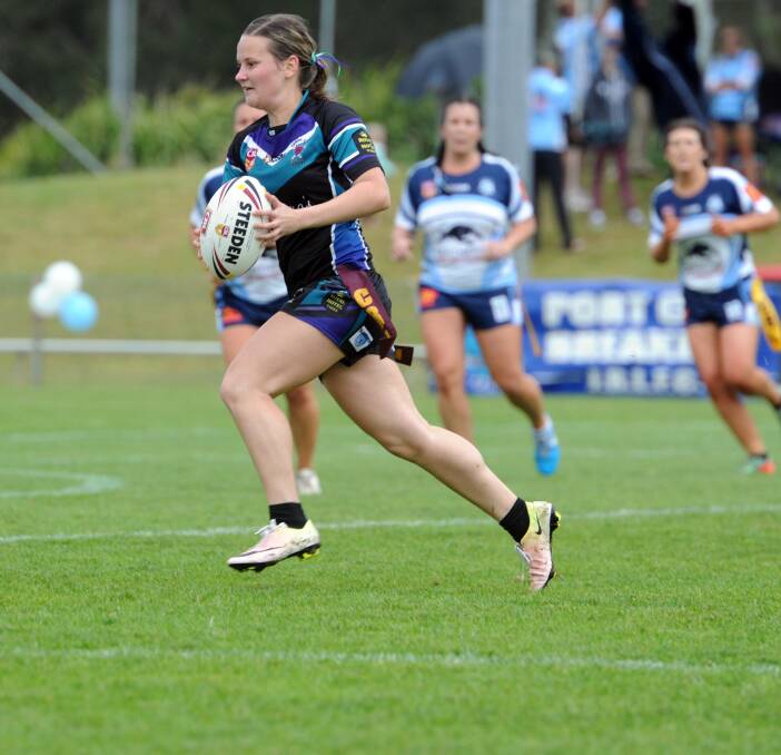 Taree City's try scorer Tahlea Rowsell heads to the line in the grand final against Port City. Photo Port News.