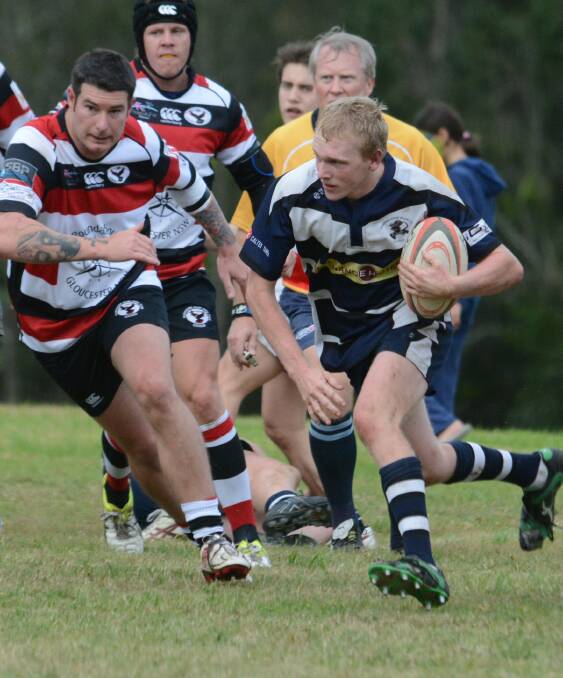 Steve Taylor from Manning River Ratz makes a charge in the recent clash against Gloucester. The Ratz are on target to finish in third place in this season's Lower North Coast Rugby competition.
