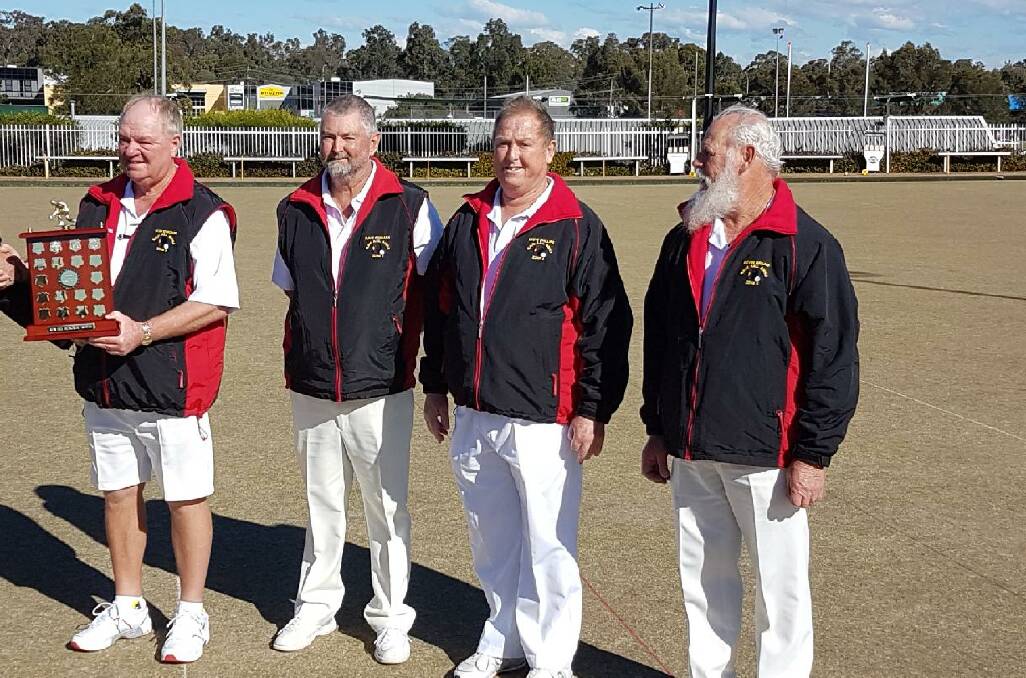 Peter Schroeder, Dave Penman, Steve Phillips and Kevin Brand with the State RSL fours championship trophy.