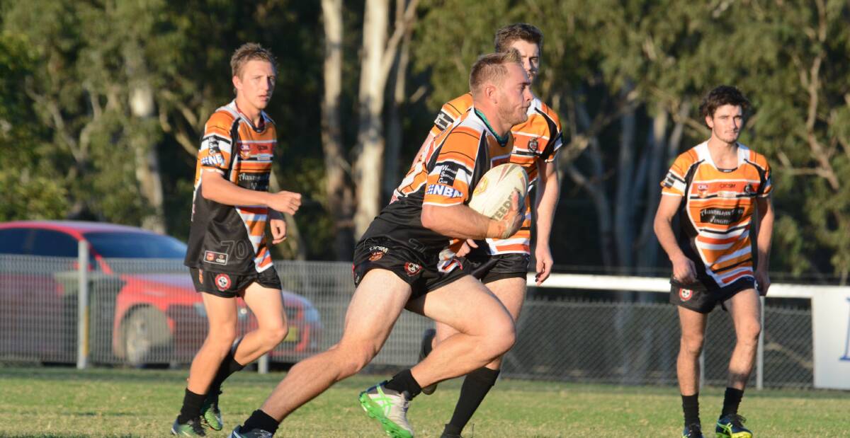 Wingham prop Rumone Jackson takes the ball to the Macleay defence during the Group Three Rugby League game at Wingham. He was one of the Tigers' best in the 30-26 victory.