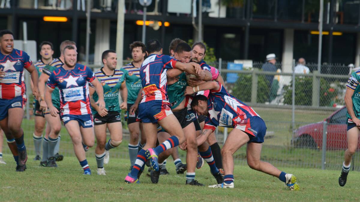 Old Bar defenders lock up Taree City prop Mat Taupe during the clash at the Jack Neal Oval.