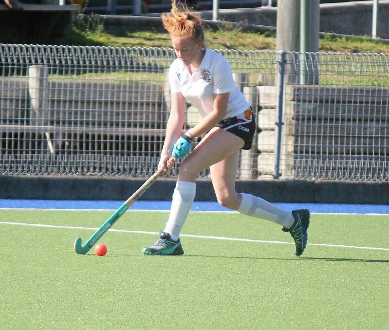 Kara Allan goes on the attack for Wingham/Tigers in the under 14 hockey clash.