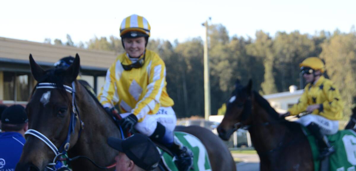 Cejay Graham is all smiles after winning on Glitra in the Taree Cup Prelude for trainer John Sprague on Thursday at the Bushland Drive track.